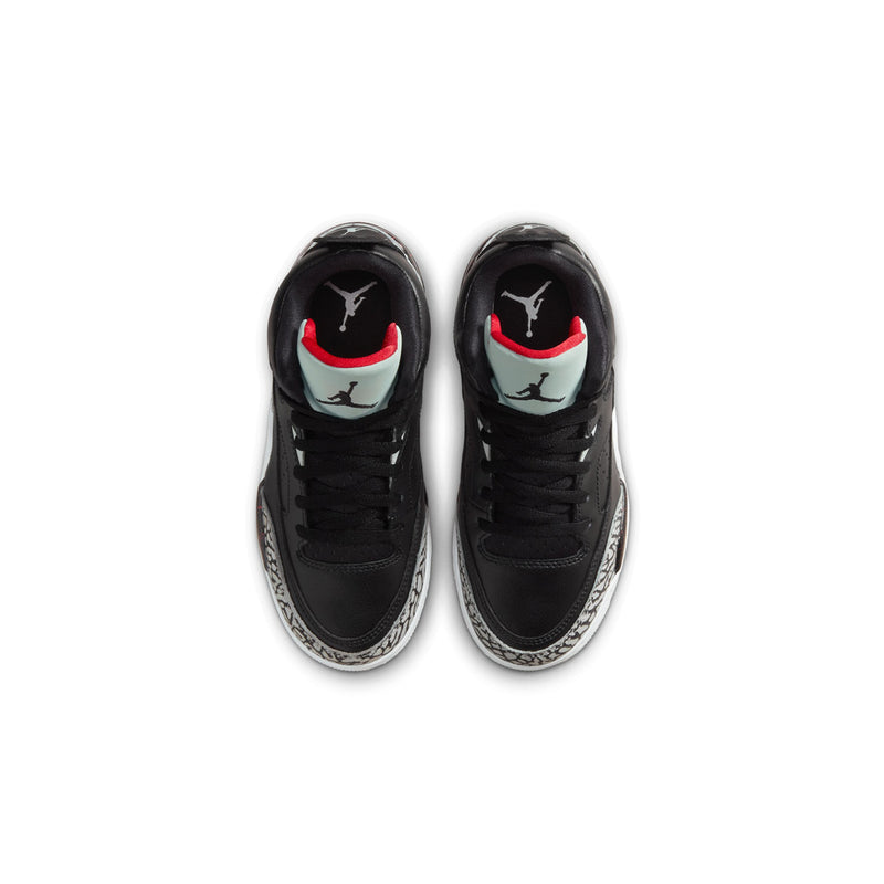 Kids black sneakers with red and white heel accents and visible Air Jordan logo