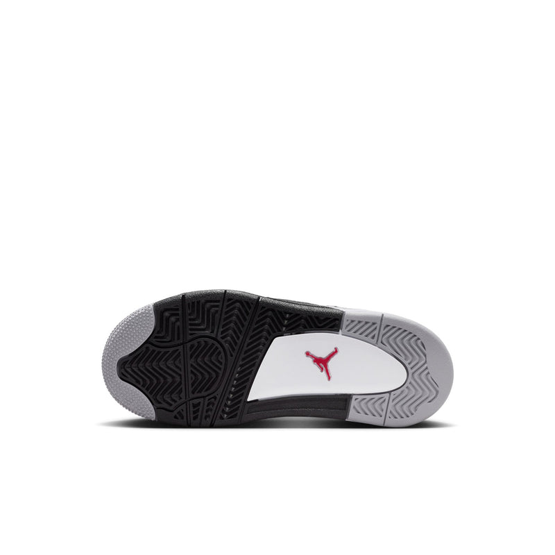 Kids shoe outsole, black tread with grey pattern and red Jumpman logo.