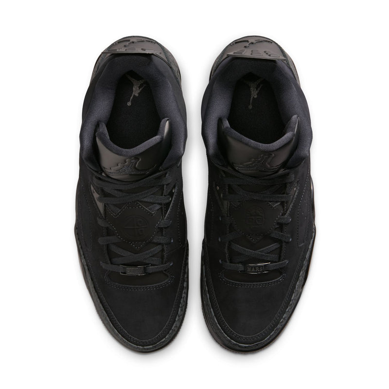 Black low-top sneakers viewed from above, showing lace-up tongue and padded collar