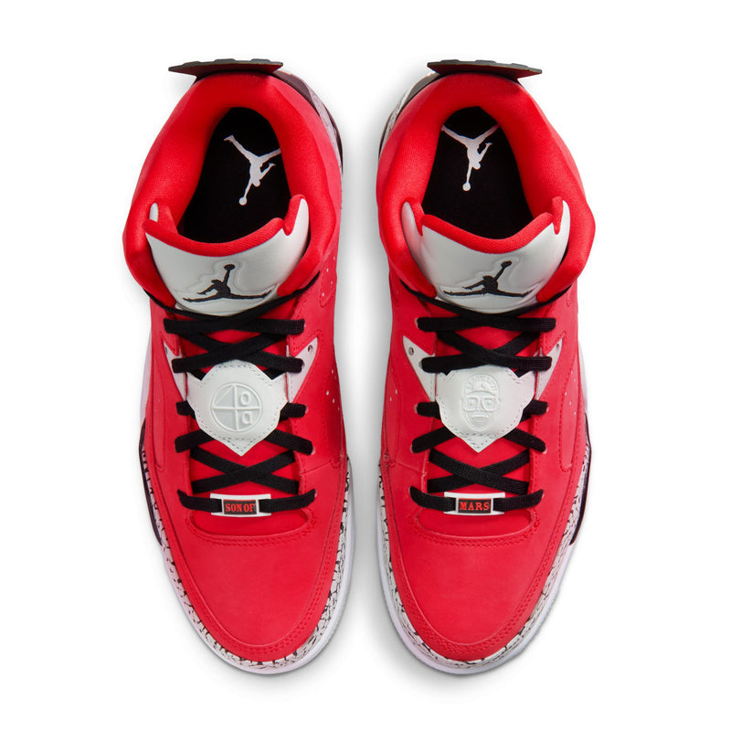 Pair of red low-top sneakers with black laces and white tongues with Jordan Jumpman