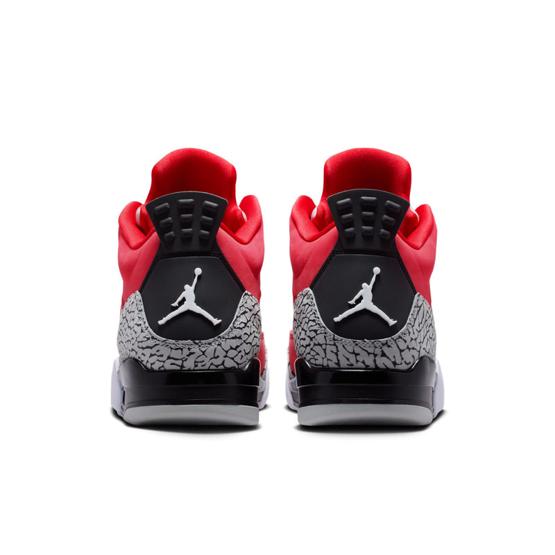 Red low-top sneakers from the back with black heels and grey speckled mid panels