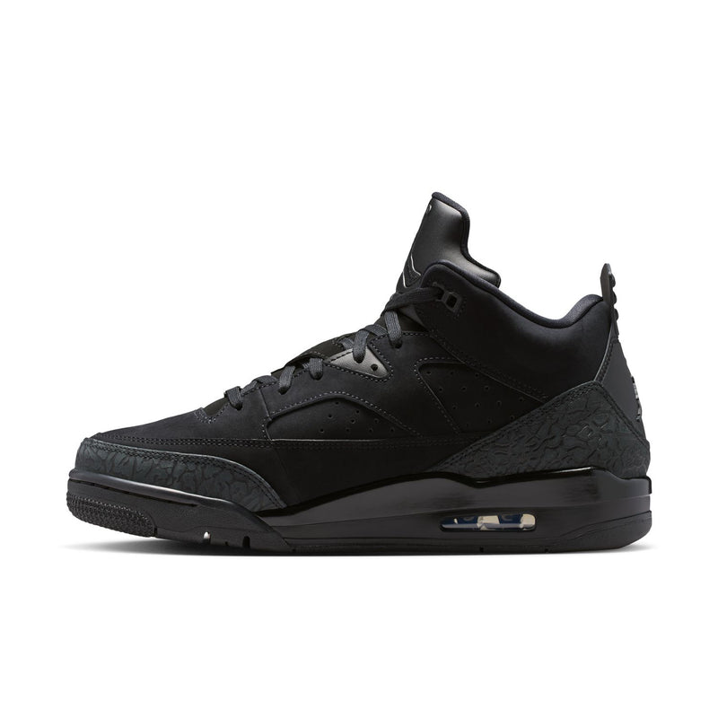 Black low-top lace-up sneakers with textured side panel and visible air window