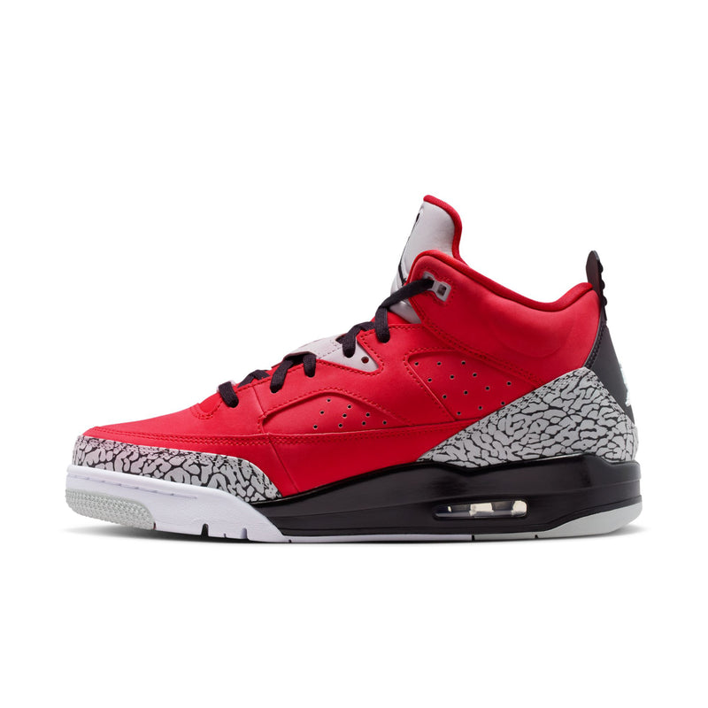 Red low-top sneakers with black laces, grey speckled side panel, and white midsole