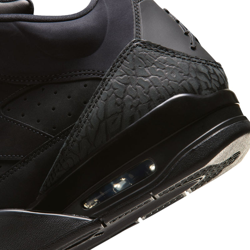 Close-up of black sneaker air midsole window and textured side overlay stitching