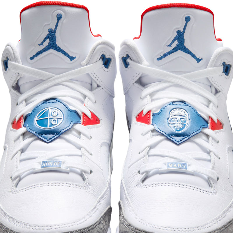 Men's white low-top sneakers pair view with blue Jumpman logo and red collar trim