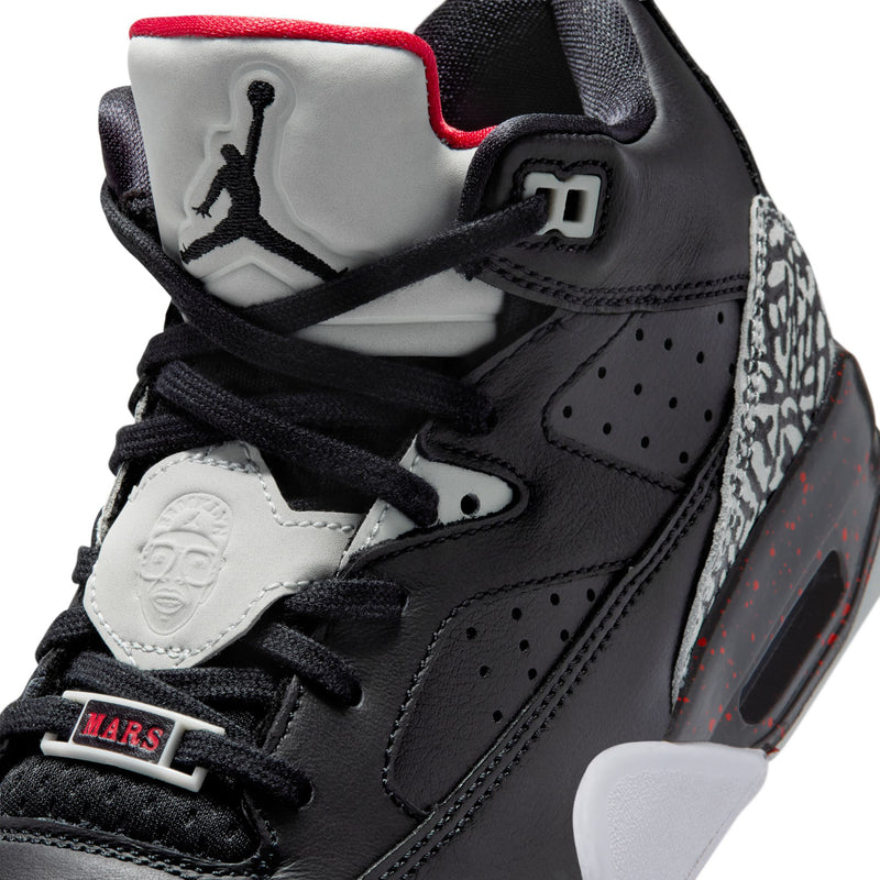 Youth high-top sneakers close-up, black upper with red collar lining and Jumpman logo