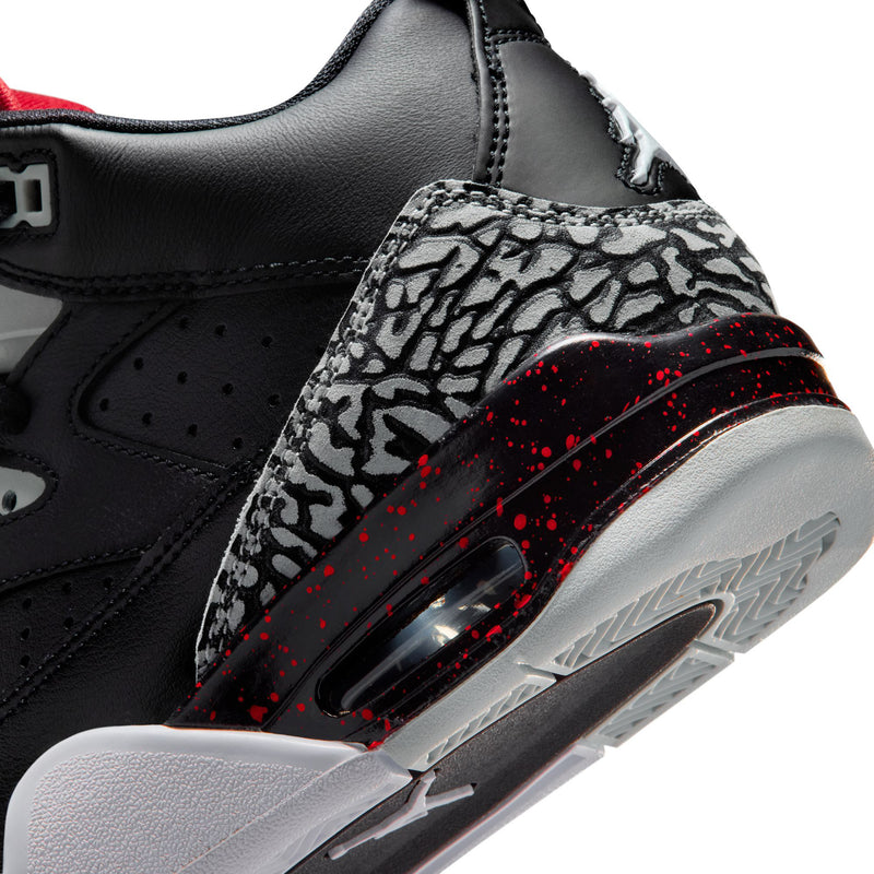 Youth high-top sneakers close-up, patterned side panel with red speckled stripe and sole