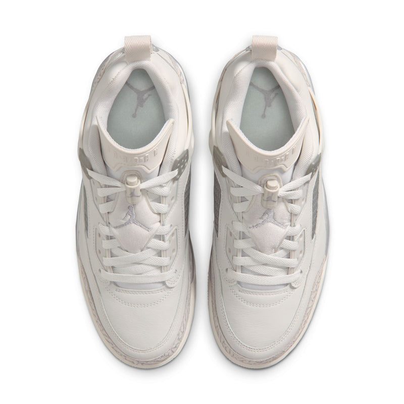 Pair of white low-top sneakers with heel tabs and padded collars