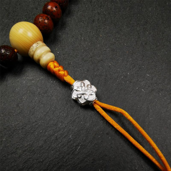 Sterling Silver Lucky Knot Bead,0.4" - Tibetan Buddhist art, front view
