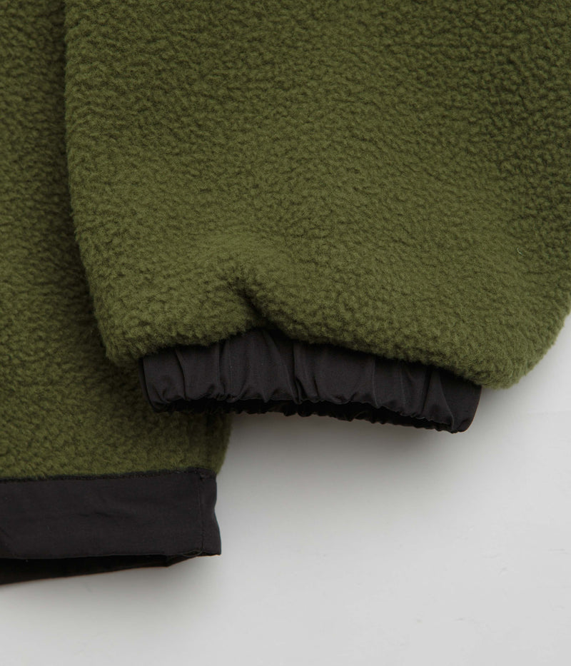 The North Face Yumiori Reversible Jacket in TNF Black and Woodland Green