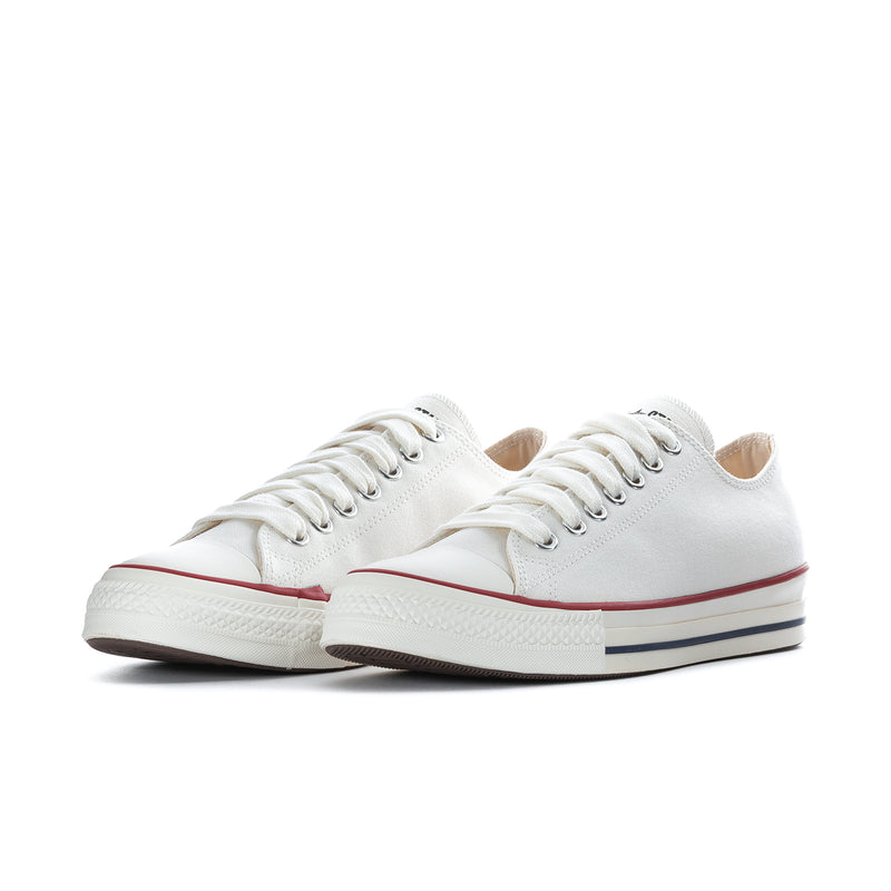 Men's lace-up low-top sneakers, white upper with red and navy side stripe details.