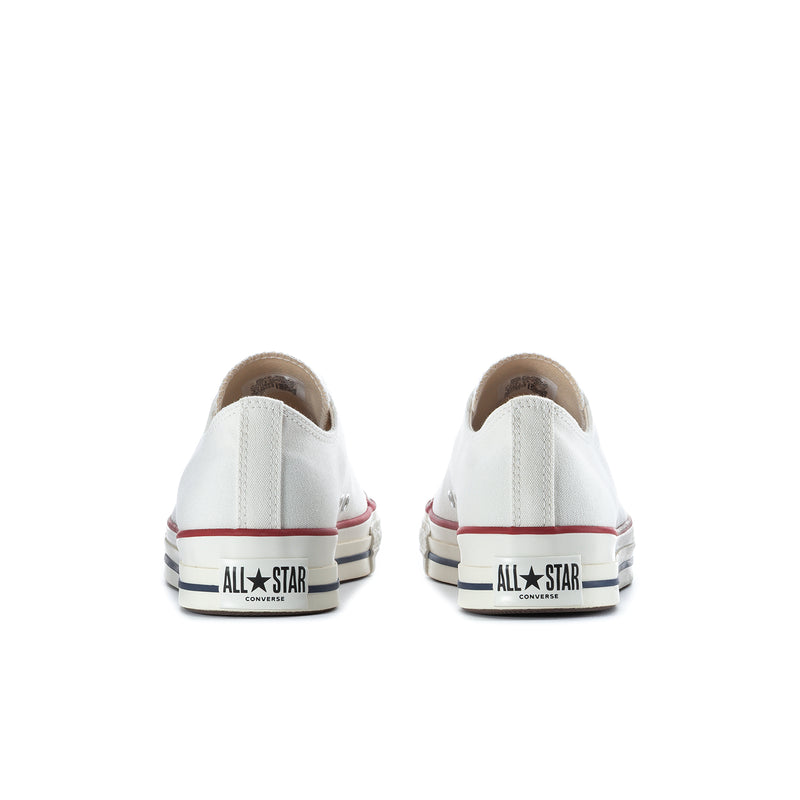 Men's low-top sneakers with heel branding, white upper and red-navy striped rubber foxing.