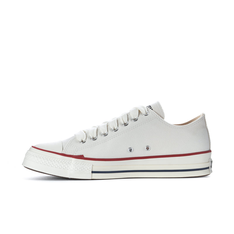 Men's low-top sneakers, white upper with metal eyelets, red and navy trim, lace-up.
