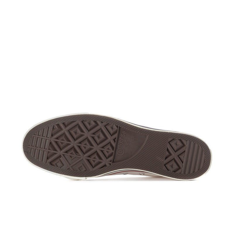 Men's sneaker outsole, dark rubber tread with geometric pattern for traction.