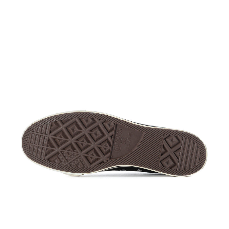 Brown rubber outsole tread for black low-top sneakers, star-pattern grip