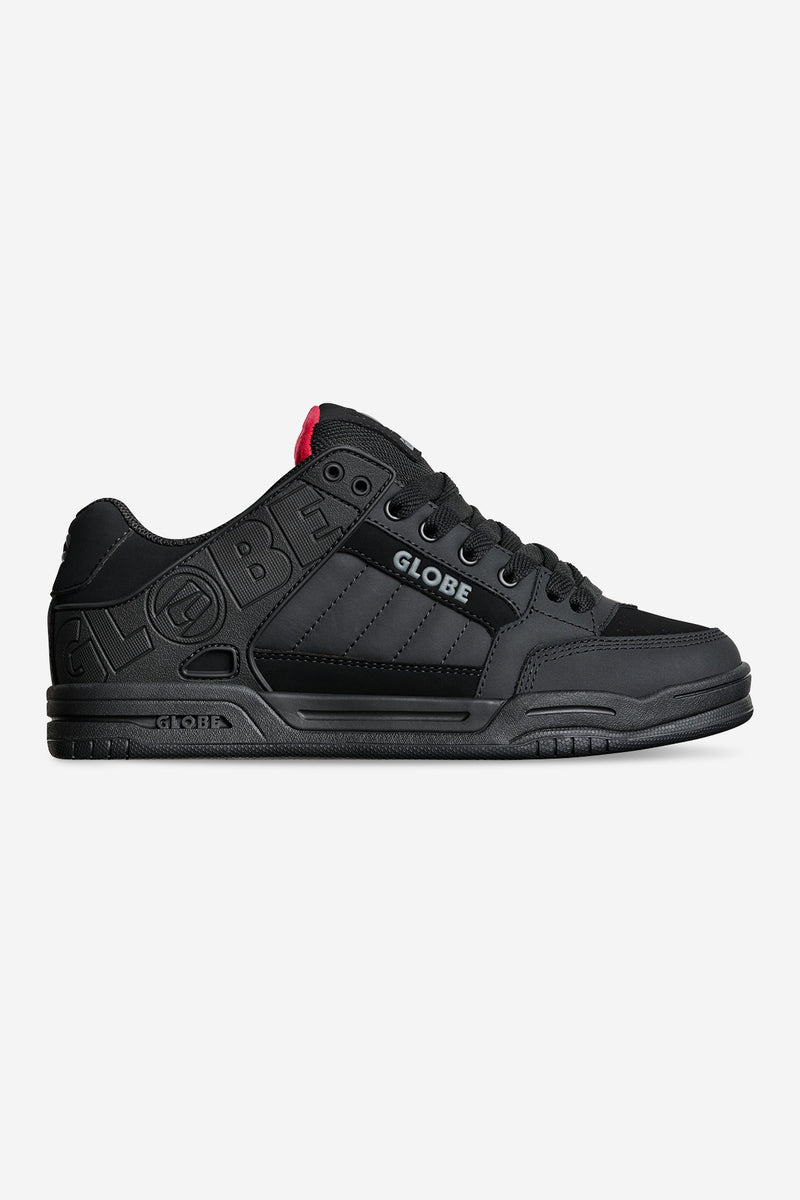 Tilt skate shoe in black with embossed Globe branding along the side and a red heel tab
