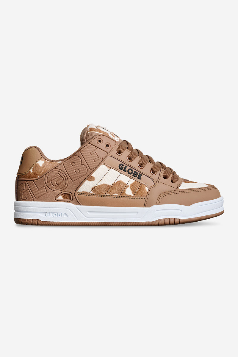 Tilt shoe in brown and white cow print with contrast stitching and a white sole.