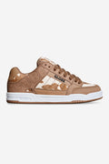 Tilt shoe in brown and white cow print with contrast stitching and a white sole.