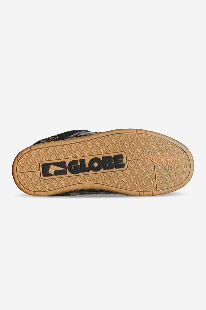 Bottom view of Globe Tilt Distressed Leather sneaker showing a tan gum outsole with a large Globe logo