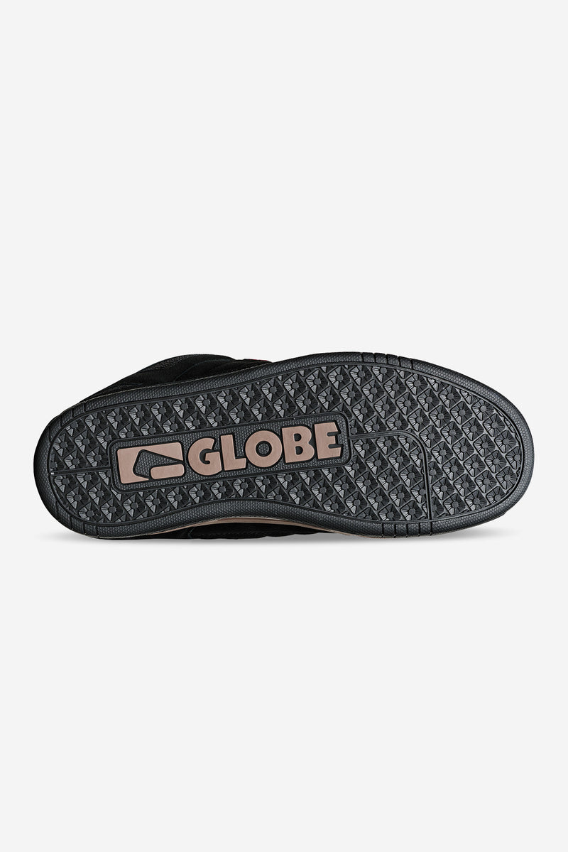 Outsole view of Tilt Prime black gum shoe with textured pattern and Globe logo