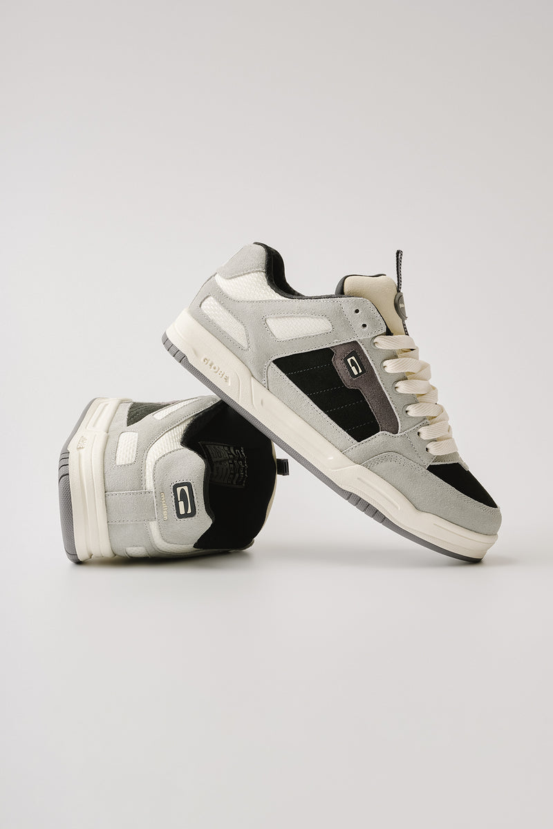 Side view of Tilt Prime Grey Mullen skate shoe with suede panels and cream laces