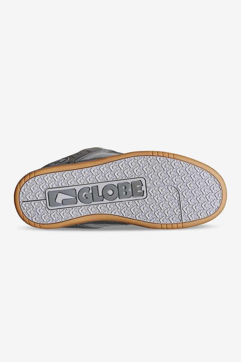 Bottom view of Tilt Smoke sneaker showing grey upper, tan gum outsole, and a large Globe logo on the sole.