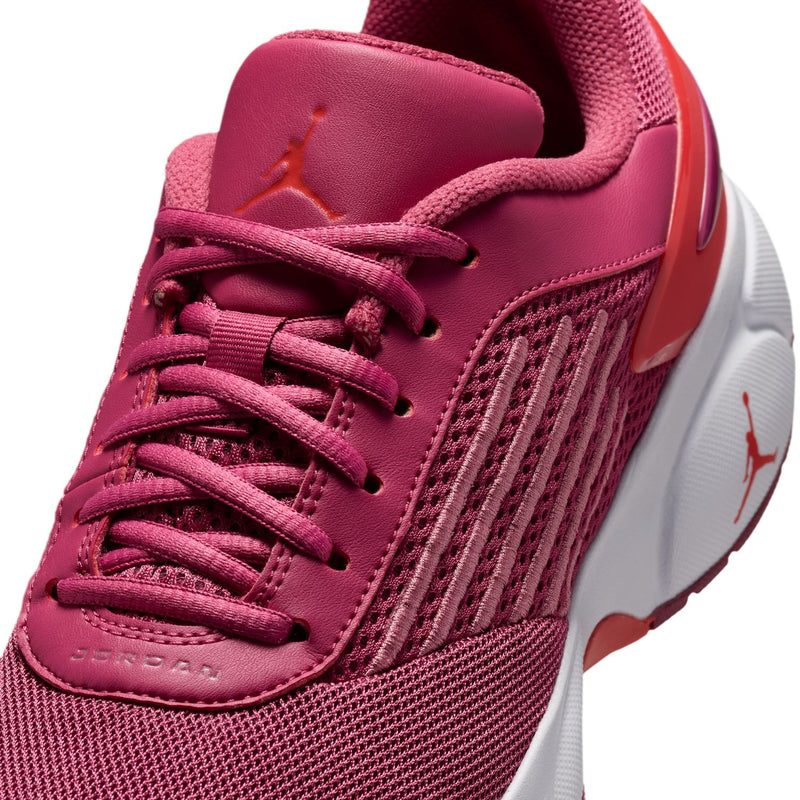 Close-up of berry pink lace-up running shoe upper with Jordan on the tongue