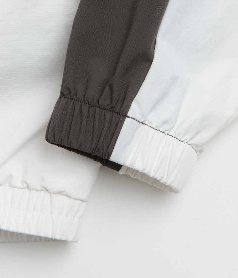 Umbro Guarding Masked Tracksuit Jacket in White and Dark Olive