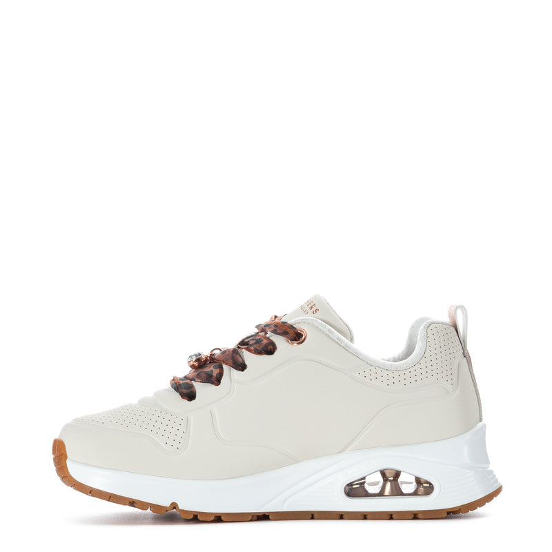 Kids white sneaker side view with leopard-print laces and tan outsole