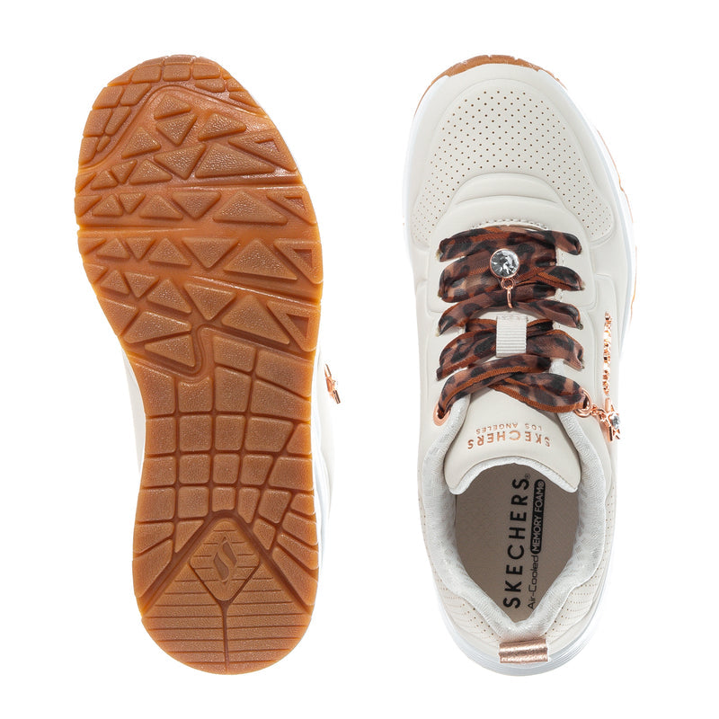 Kids sneaker outsole and inside shoe, brown tread and white upper with leopard laces