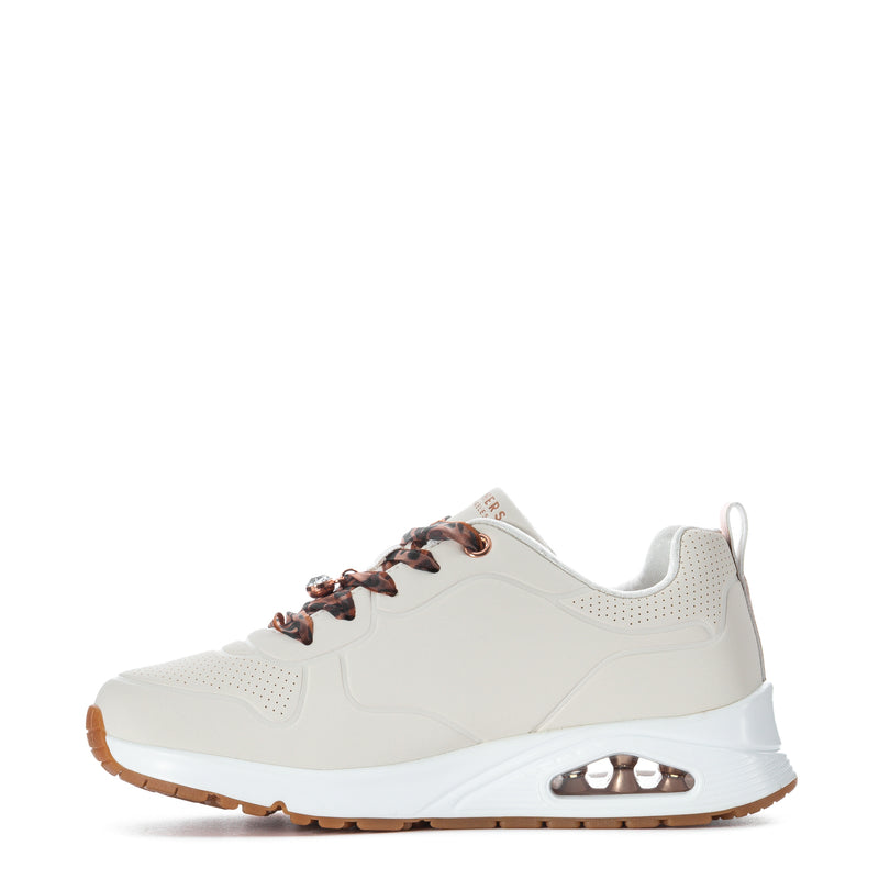 Youth white sneaker side view with leopard lace detail and rose-gold accents