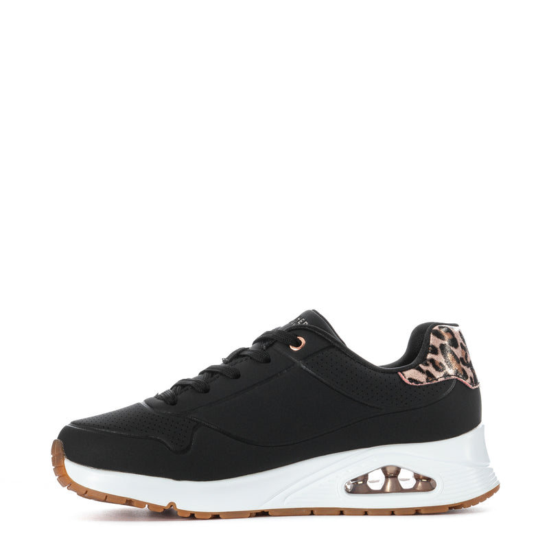 Black youth sneaker with leopard side panel, rose-gold chain detail, white midsole