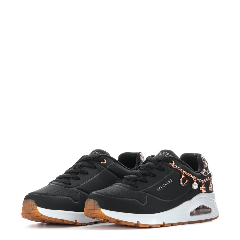 Black youth sneaker pair with rose-gold charm chain, leopard accents, cushioned sole