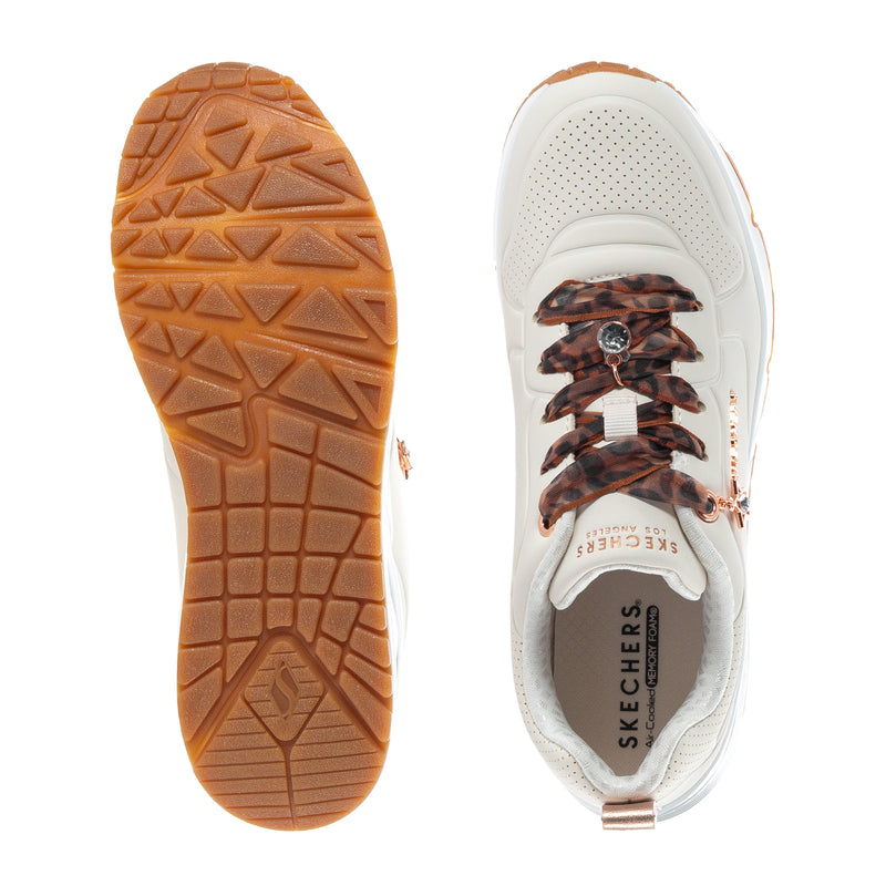 Youth sneaker outsole and side detail; white upper with brown traction tread