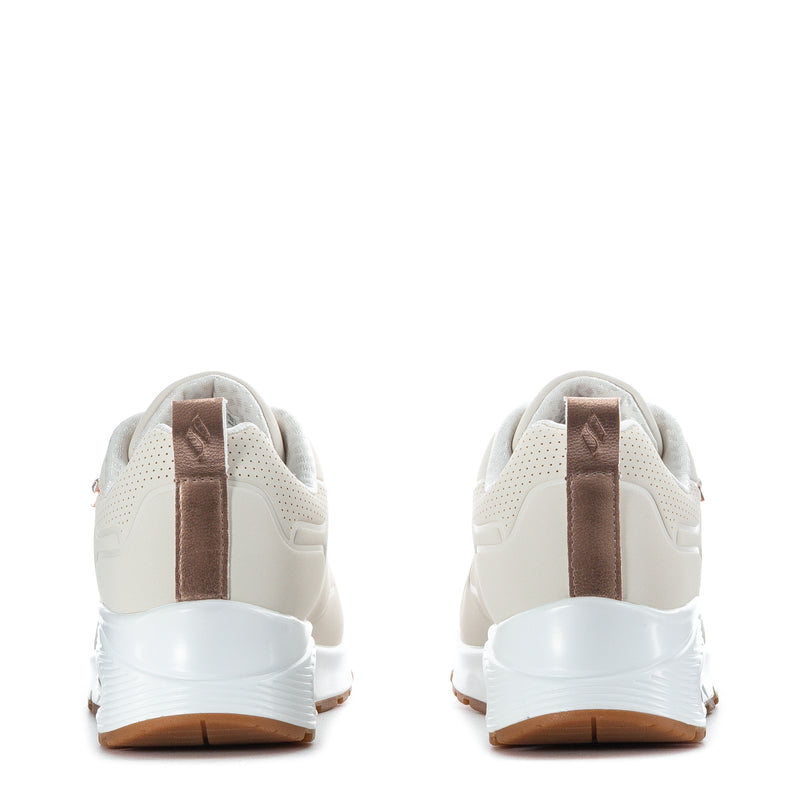 Youth sneaker back view with cream heel, rose-gold lace pull tab, cushioned sole