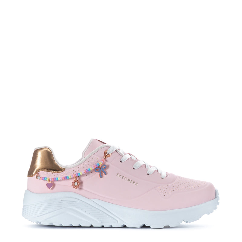 Pink youth sneaker with gold heel detail, white laces, and beaded side charm accents