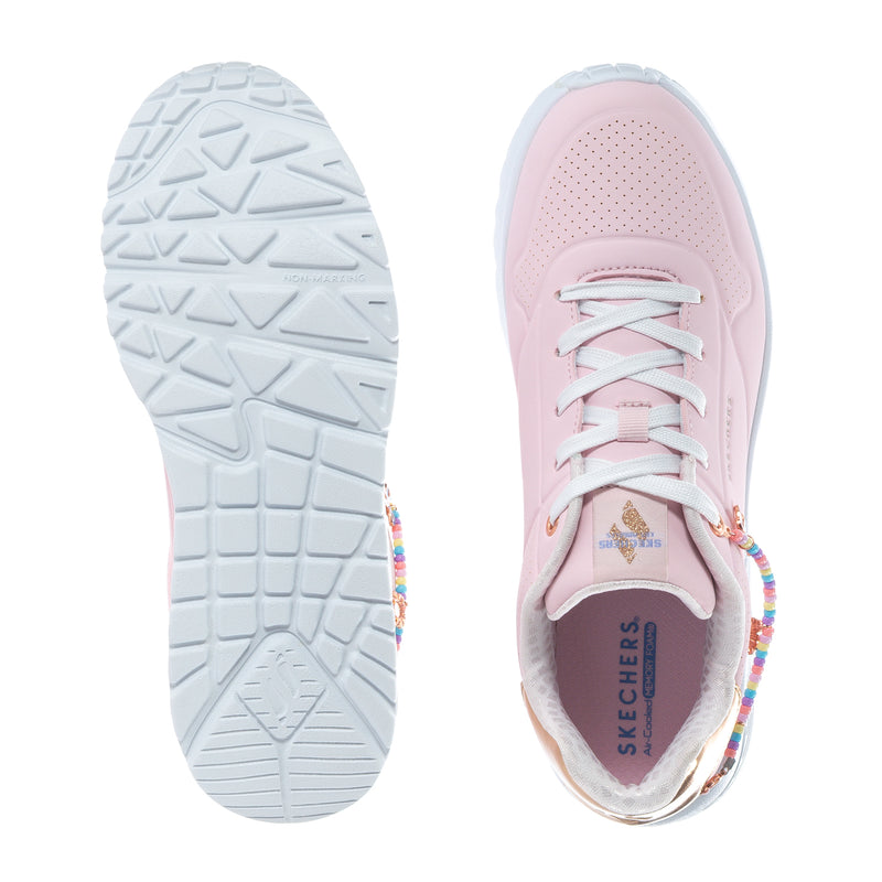 Pink youth sneaker with white tread outsole and lace-up front view