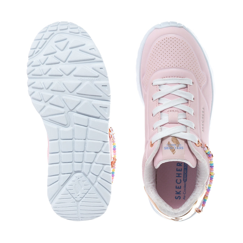 Kids pink sneakers with white tread sole and SKECHERS insole
