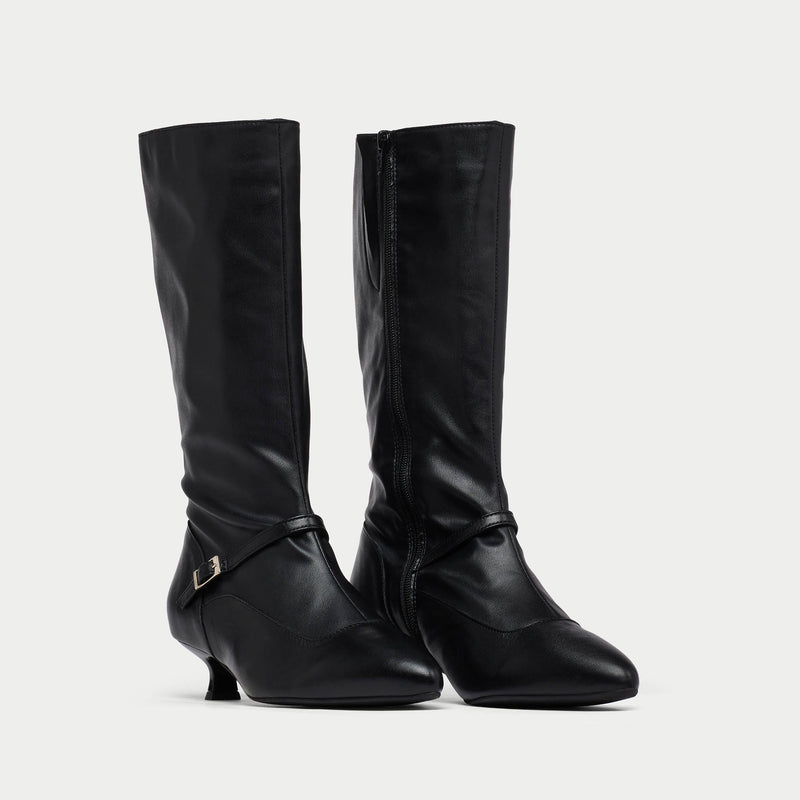 Pair of black Veronica knee-high boots with a slight heel on a light gray background