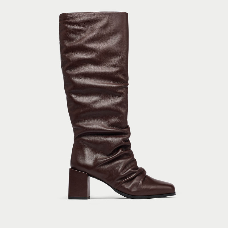 Brown knee-high boot on a light gray background
