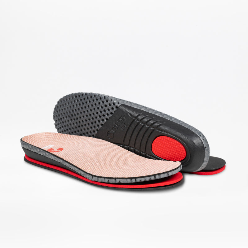 A pair of cushioned, breathable insoles with a beige top, black and red midsole, and textured outsole—one facing up, one showing the underside. Ideal for BILLY Footwear Women's Blush BILLY Comfort Knit shoes.