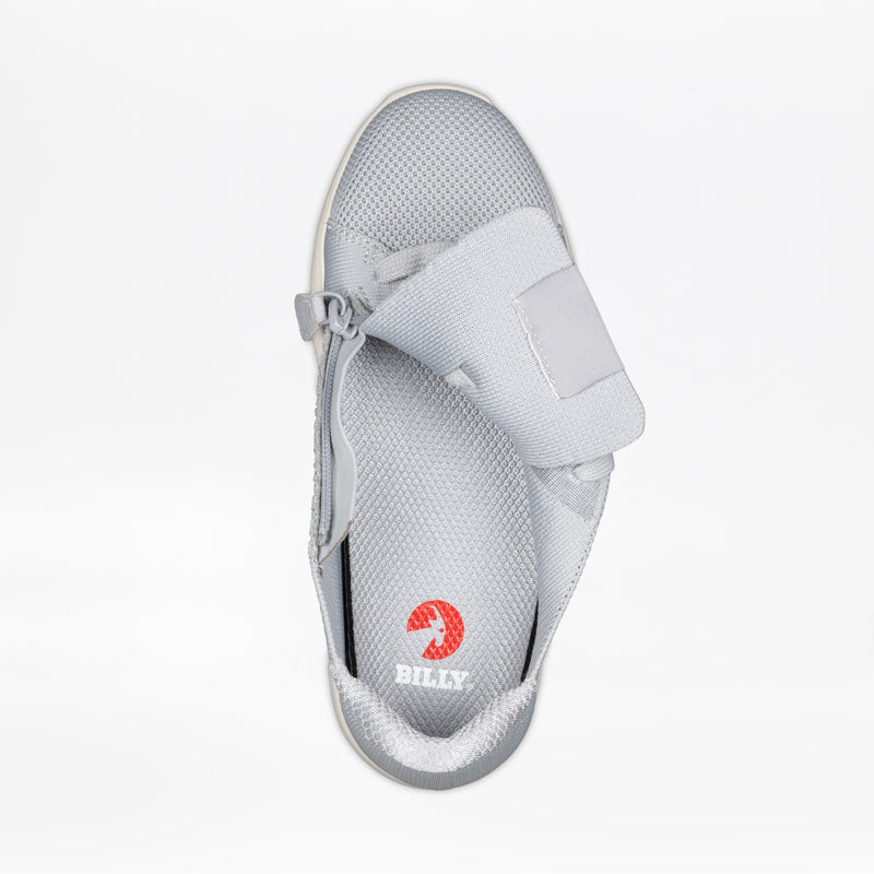 The Women's Grey BILLY Comfort Knit sneaker by BILLY Footwear is shown from above on a white background with the medial zipper open, revealing the breathable insole with a red BILLY logo.