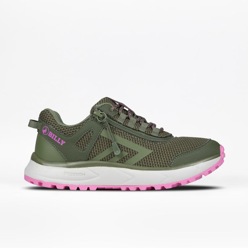 The Women's Olive/Pink BILLY Inclusion Trail by BILLY Footwear features a mesh upper, pink accents, white and pink sole, easy on/off zipper, and "BILLY" in pink on the heel. Inspired by hiking for style and accessibility.