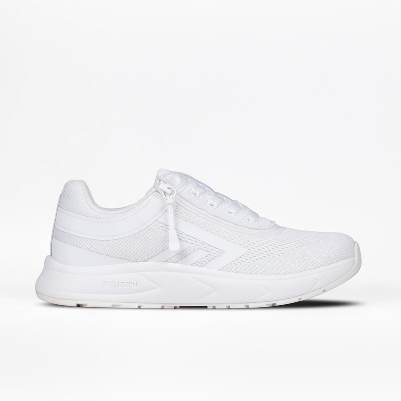 The Women's White BILLY Sport Inclusion by BILLY Footwear is an athletic sneaker with mesh texture, low profile, cushioned insole, and rubber sole, shown from the side against a white background.