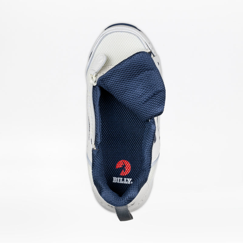 The Women's White/Navy BILLY Limitless 253 by BILLY Footwear is shown from above with an open side zipper, revealing the red BILLY logo insole, a folded tongue, sensory friendly design, and dark blue mesh lining.