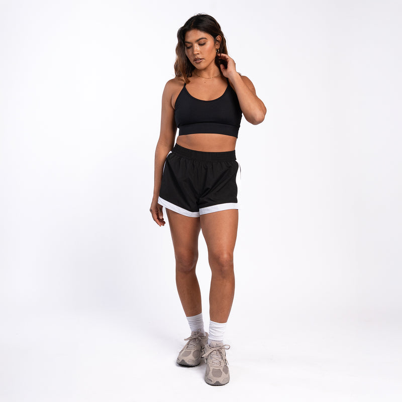 Womens black woven shorts with elastic waistband and white trim