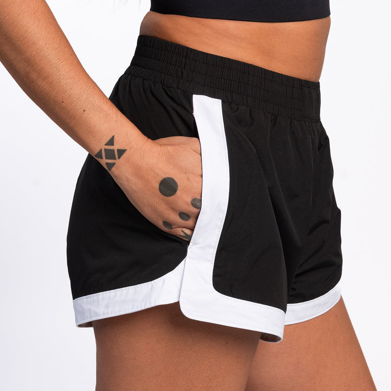 Womens black woven shorts with elastic waistband and white side panel