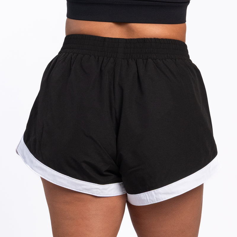 Womens black woven shorts with elastic waistband and white hem band