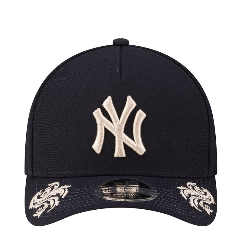 Navy baseball cap with white Yankees logo embroidery on the front panel