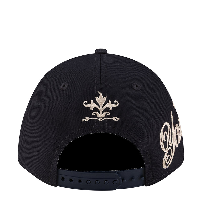 Navy cap with white fleur-de-lis front embroidery and New Era logo patch